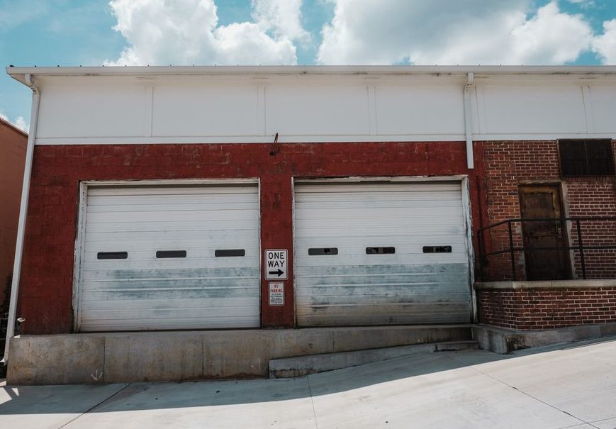 Stock photo of garage door roller replacement work